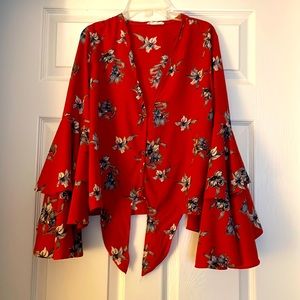 Rust floral blouse with tie. Low neck